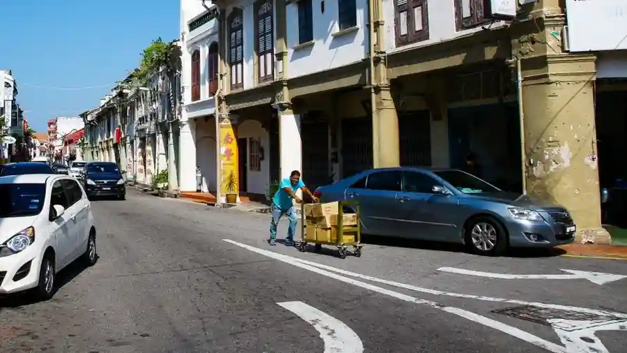 Colourful heritage shophouses lining a street in an old Malaysian town