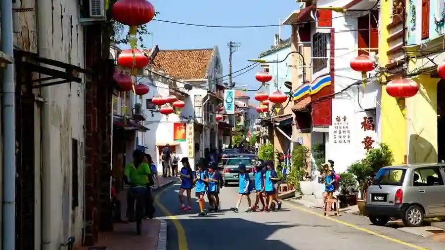 Historic shophouses and lantern-lined street in Melaka's heritage district