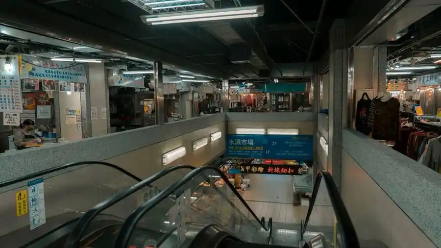 Modern shopping mall interior with escalators in Kuala Lumpur city centre