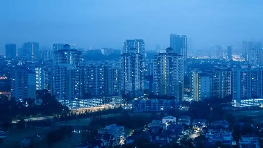 Blue-hour view of apartment blocks across the Ampang skyline