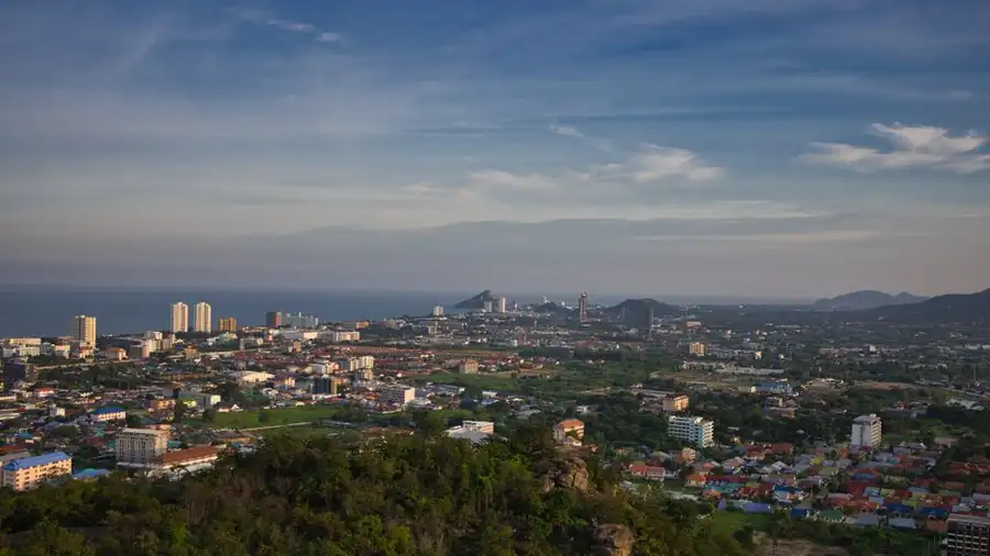 Coastal city skyline at dusk, similar in scale to Kota Kinabalu's waterfront