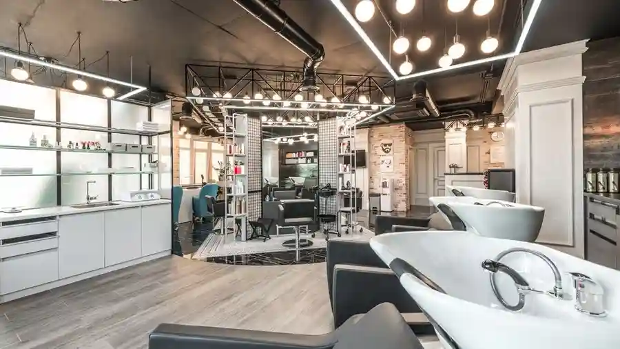 Spacious beauty salon interior with styling chairs and modern lighting