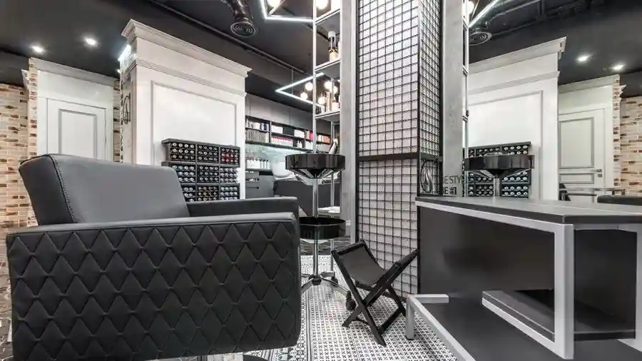 Modern hair salon interior with styling chairs and washbasins