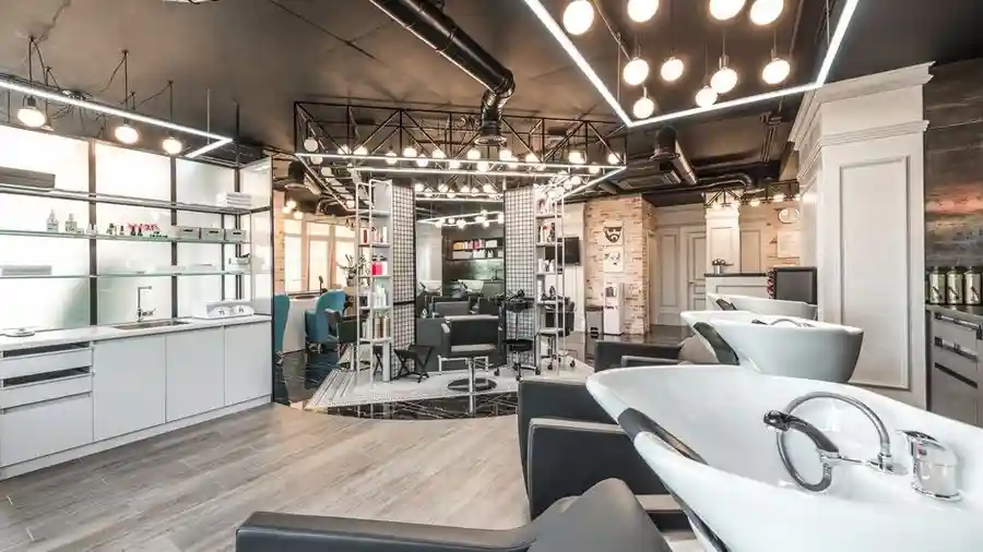 Modern beauty salon interior with styling chairs and soft lighting