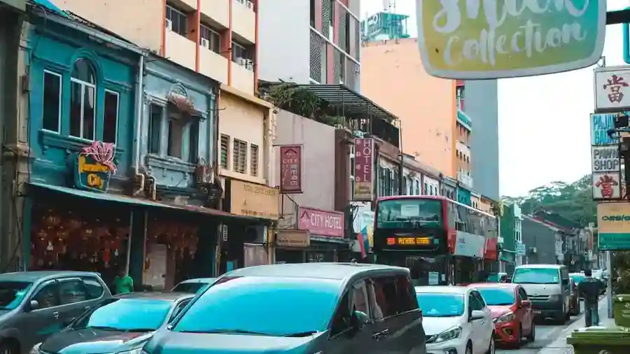 Street of shophouses and cars in Kuala Lumpur