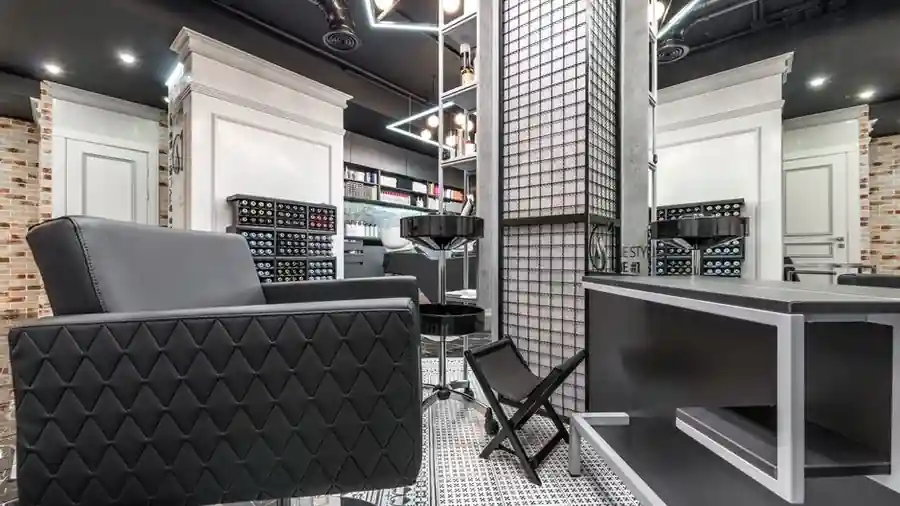 Modern hair salon interior with styling chairs and mirrored walls