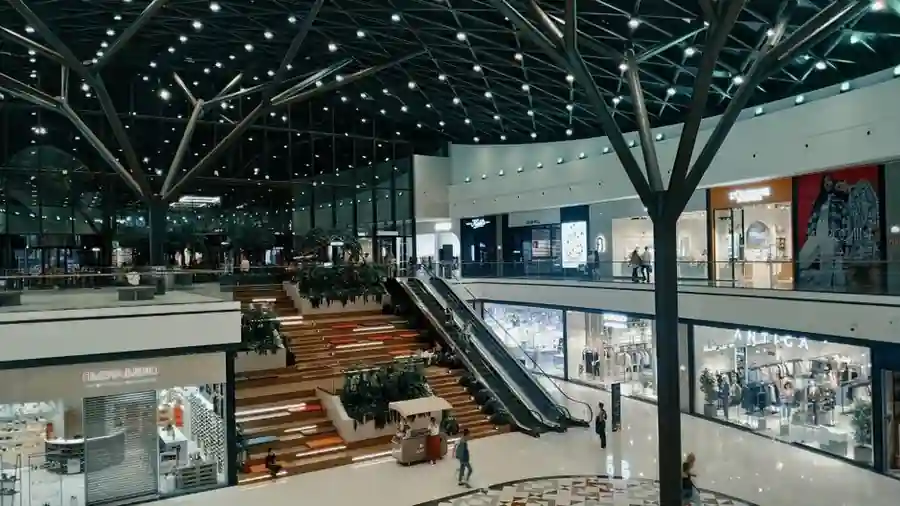 Modern shopping mall interior in Kuala Lumpur with escalators