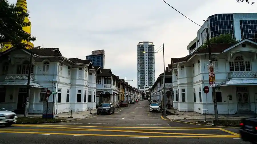 Row of colonial-era shophouses on a street in George Town, Penang