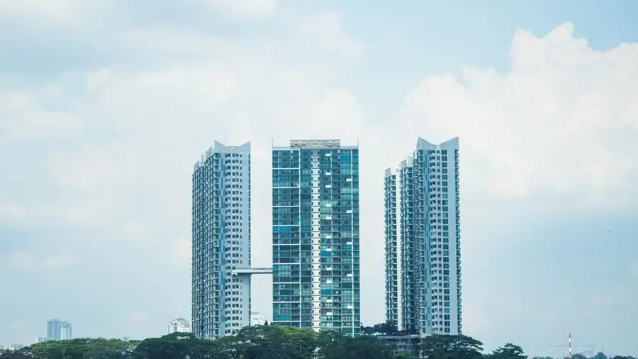 High-rise residential towers under a bright sky in Kuala Lumpur
