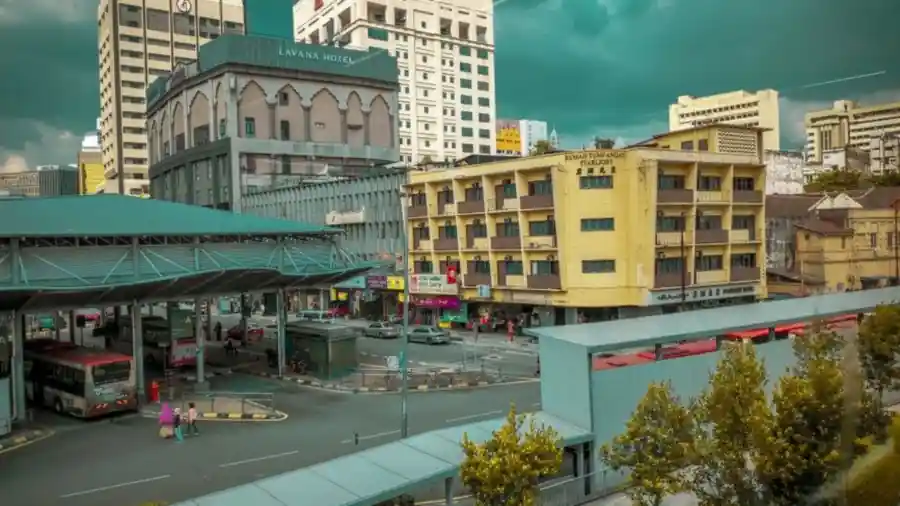 Busy street and bus station in a Kuala Lumpur neighbourhood