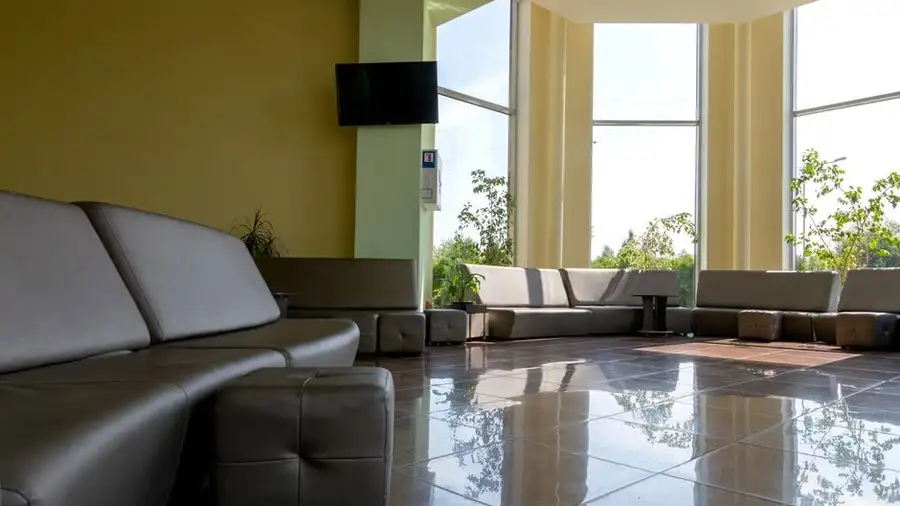 Bright waiting lounge with large windows in a private medical centre