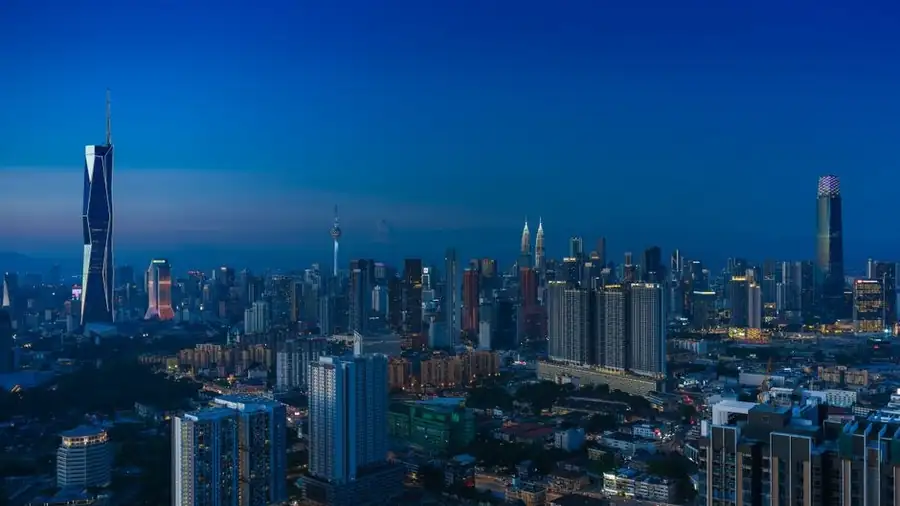 Kuala Lumpur city skyline at blue hour seen from above
