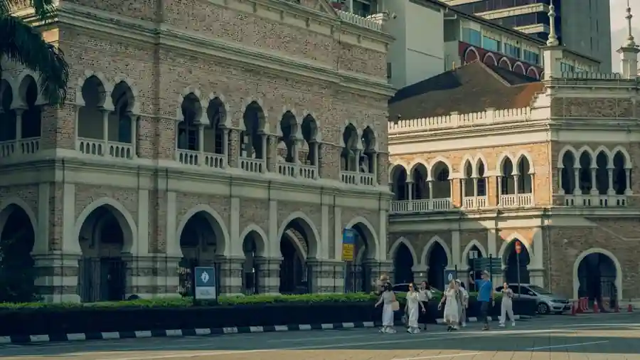 Historic government building on a Kuala Lumpur street in daylight