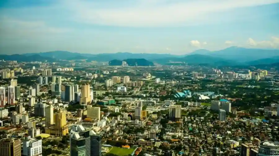 Aerial daytime view of the Kuala Lumpur skyline and surrounding city