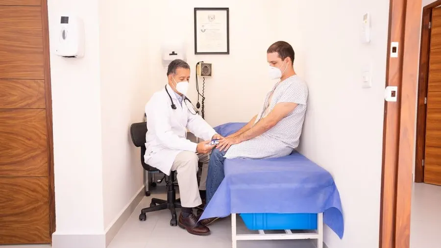 Doctor and patient in a consultation room reviewing a procedure