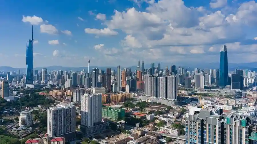 Aerial daytime view of the Kuala Lumpur skyline and surrounding city
