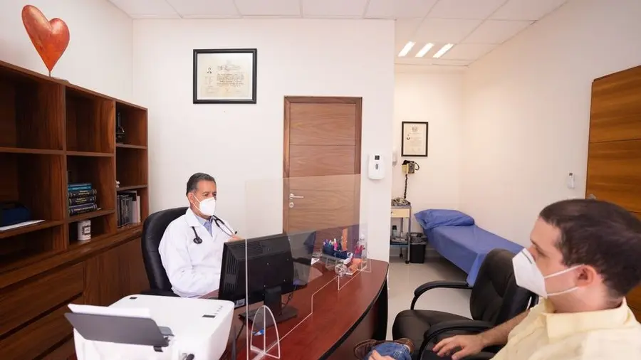 Doctor and patient in a consultation room reviewing a procedure