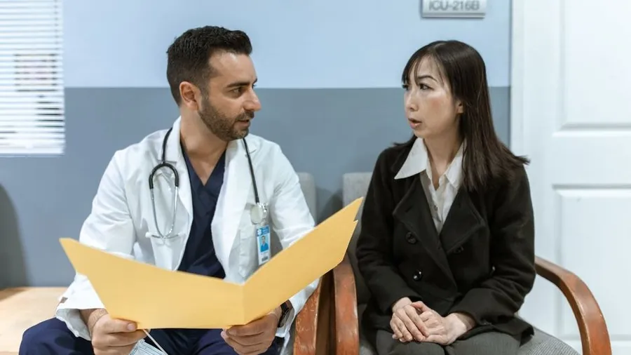 Surgeon consulting with a patient in a clinic office
