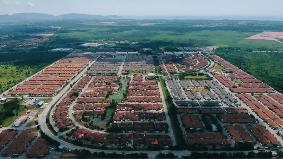 Row of shoplots and commercial signage in a suburban Klang Valley township