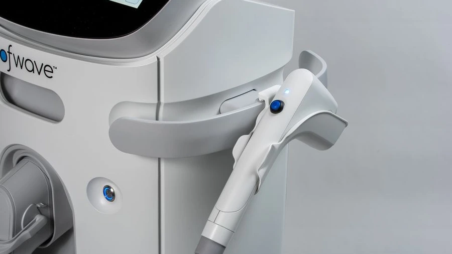 Close-up of a diode laser hair removal handpiece on its stand