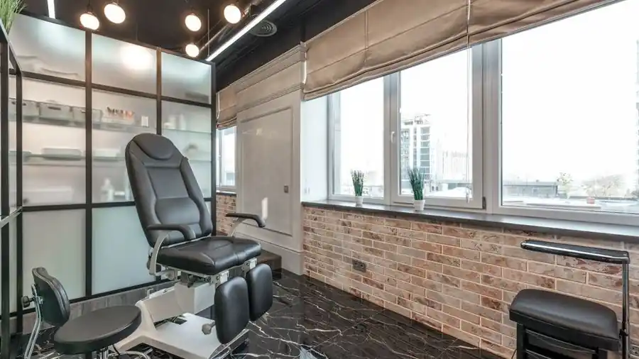 Empty aesthetic treatment room with equipment