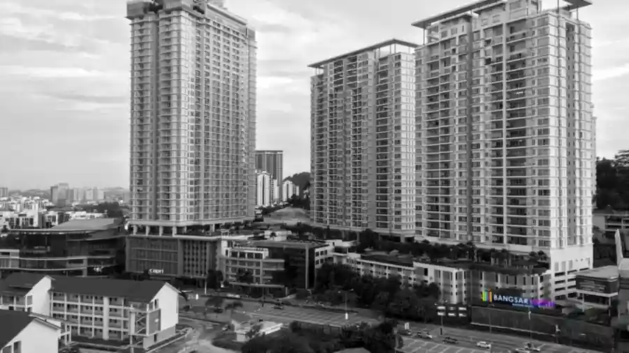 High-rise residential towers beside a main road in Kuala Lumpur