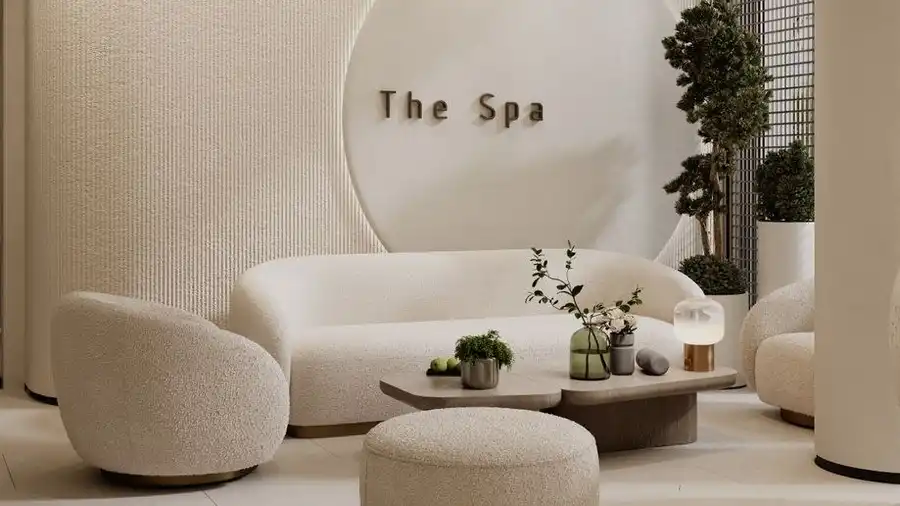 Cosy spa lounge with white sofas and plants