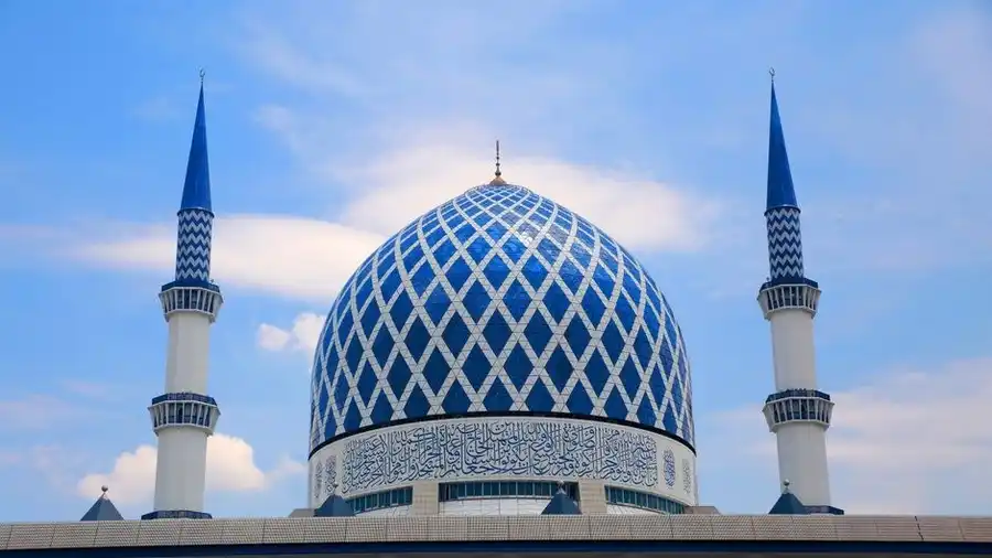 Blue-tiled dome and minarets of a mosque in Shah Alam, Malaysia
