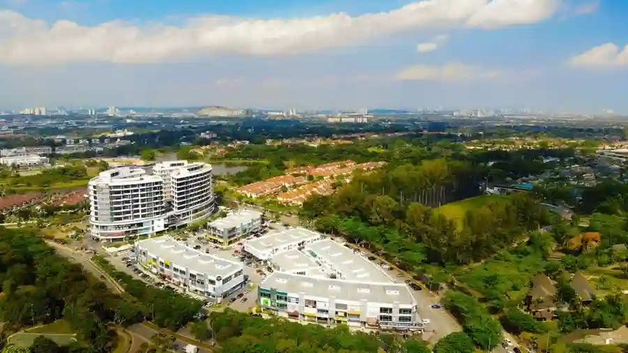 Aerial view of a suburban township with commercial buildings near Shah Alam