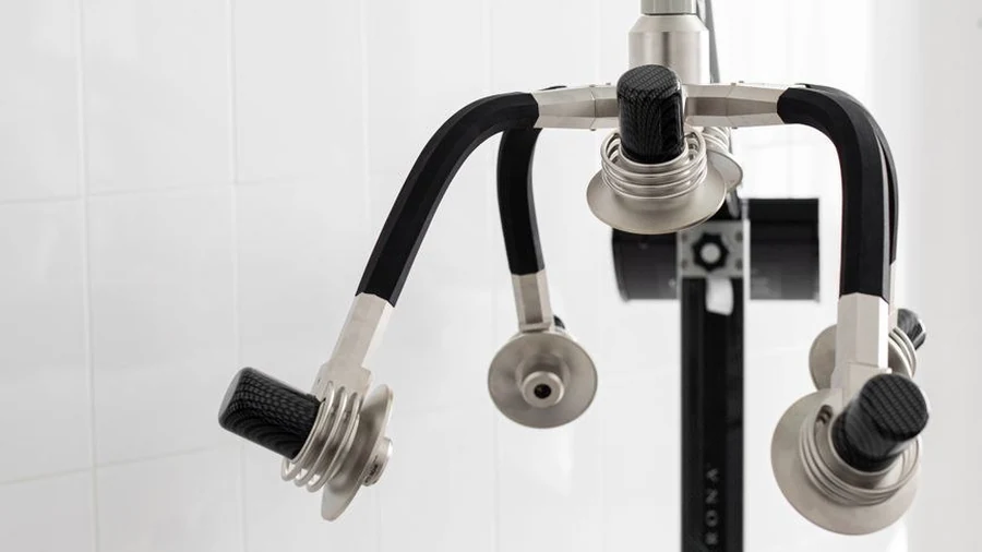 Multi-head body contouring device standing in an empty clinic room