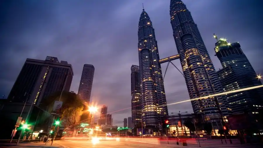 Kuala Lumpur city centre skyline at night with the Petronas Towers lit up